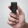 A hand holding a black USB-C charger. Produktbild-Vorschau