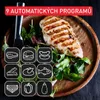 A grilled chicken breast served with a salad on a wooden plate, with icons representing different food programs. Produktbild-Vorschau