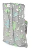 A folded blanket with a dinosaur pattern is draped over a chair. Náhled obrázku produktu
