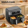 A dual-basket air fryer is shown on a wooden countertop, with food items like french fries and broccoli inside the baskets. There are also plates of fried food and onion rings nearby. Produktbild-Vorschau