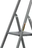 A close-up view of a gray metal step stool. Voir les images du produit