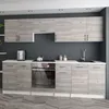 A modern kitchen with light wood cabinets and a dark gray wall. Náhled obrázku produktu