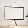 A white projection screen on a black tripod stand against a white wall. Podgląd zdjęcia produktu
