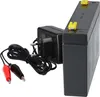A black battery and a black charger with red and black alligator clips are shown against a white background. Anteprima dell’immagine prodotto
