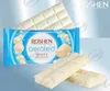 Product packaging and chocolate bars displayed against a gradient background. Produktbild-Vorschau