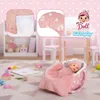 A nursery room setting with a doll in a bassinet, surrounded by toys and furniture. Produktbild-Vorschau