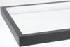 A close-up view of a black frame with a white interior, likely part of a light fixture. Produktbild-Vorschau