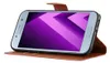 A Samsung Galaxy A5 2017 smartphone in a brown leather flip case, displayed horizontally. Podgląd zdjęcia produktu