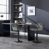 Two dark gray bar stools are placed around a marble-topped bar in a modern dining area. Náhľad obrázku produktu