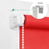 Close-up of a red roller blind being installed using a clamp-on bracket, with an inset showing a measurement guide. Produktbild-Vorschau