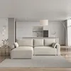 A modern living room with a sofa and kitchen in the background. Produktbild-Vorschau