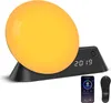 A sunrise alarm clock with a digital display, a smartphone, and a remote control. Náhľad obrázku produktu
