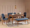 A dining set with a wooden table, blue upholstered bench, and blue chairs in a room with paneled walls. Voir les images du produit