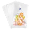 A stack of clear cellophane bags with one bag filled with colorful swirl candies. Podgląd zdjęcia produktu