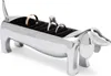 A silver dachshund-shaped ring holder with rings inside, on a white background. Podgląd zdjęcia produktu