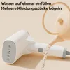 A handheld garment steamer is being filled with water from a small watering can. The text overlay suggests it can hold enough water for multiple garments. Produktbild-Vorschau