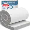 A rolled-up mattress topper is shown on top of an unrolled topper, with a product box in the background. Produktbild-Vorschau