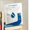 A product package for a Wessper P3 Humifill is placed on top of books on a shelf. Podgląd zdjęcia produktu