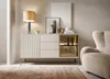 A modern living room setting with a sideboard, chair, and rug. Produktbild-Vorschau