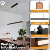 A modern black linear LED pendant light with wood accents is shown hanging above a wooden desk in a home office setting. The image also features inset panels highlighting product features. Produktbild-Vorschau