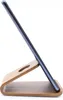 A smartphone is placed on a wooden stand against a white background. Podgląd zdjęcia produktu