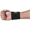 A person's wrist wearing a black wristband with orange stripes. Náhľad obrázku produktu
