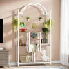 A multi-tiered plant stand with an arched top, decorated with various potted plants and decorative items. Anteprima dell’immagine prodotto