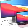 A laptop and a monitor are connected to a USB hub. Voir les images du produit