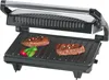 A close-up shot of an open panini grill with two steaks cooking on the grill plates. Produktbild-Vorschau