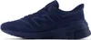 A side view of a navy blue New Balance sneaker against a white background. Produktbild-Vorschau