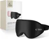 A black Tech-Protect eyeshade sleep mask is shown in the foreground, with its packaging in the background. The packaging displays an image of two sleep masks, one black and one pink. Anteprima dell’immagine prodotto