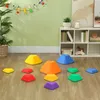 A children's playroom with colorful stepping stones arranged on the floor and decorative figures hanging on the wall. Náhľad obrázku produktu