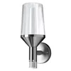 A modern outdoor wall light with a clear glass shade and a brushed metal base. Produktbild-Vorschau