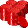 Stacks of red jar lids are arranged on a white background. Podgląd zdjęcia produktu