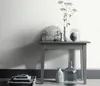 A still life arrangement on a console table against a white wall. Náhľad obrázku produktu