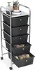A rolling storage cart with five black drawers, topped with a metal shelf holding a soap dispenser, a spray bottle, a small plant, and a bar of soap on a dish. Produktbild-Vorschau