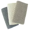 Three kitchen towels in different shades of gray and beige, arranged diagonally. Produktbild-Vorschau