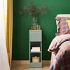 A bedside table next to a bed. Náhľad obrázku produktu