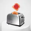 A stainless steel toaster with two slices of toast, one of which is popping up and covered in jam. Produktbild-Vorschau