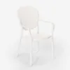 A white plastic chair with armrests is shown against a white background. Voir les images du produit