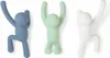 Three wall hooks shaped like climbing figures in different colors. Náhled obrázku produktu