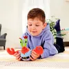 A young boy is lying on the floor, playing with a plush toy of Mr. Krabs from SpongeBob SquarePants. Anteprima dell’immagine prodotto