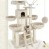 A multi-level cat tree with various platforms, scratching posts, and hanging toys, featuring two cats. Náhled obrázku produktu