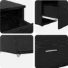 A collage of four close-up images showing details of a black wooden drawer cabinet. Produktbild-Vorschau