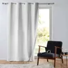 A white curtain is partially drawn across a window, revealing a dark armchair with a book on it. Produktbild-Vorschau
