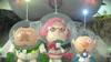 Three characters in astronaut suits stand in front of a spaceship. Produktbild-Vorschau