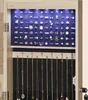 A jewelry cabinet with rings and necklaces displayed inside. Produktbild-Vorschau