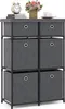 A gray fabric dresser with six drawers and a black metal frame is shown against a white background. On top of the dresser are a clock, some books, a vase of flowers, and a cup of coffee. Anteprima dell’immagine prodotto