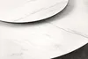 A close-up view of two round tabletops with a marble-like pattern, one slightly overlapping the other. Produktbild-Vorschau