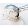 A close-up shot of an ice cream scoop filled with ice cream. Náhľad obrázku produktu